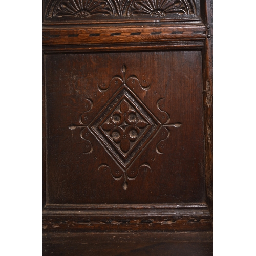 170 - A 17th century oak 'wainscot' armchair, Leeds area, Yorkshire The scroll carved top rail above a lun... 