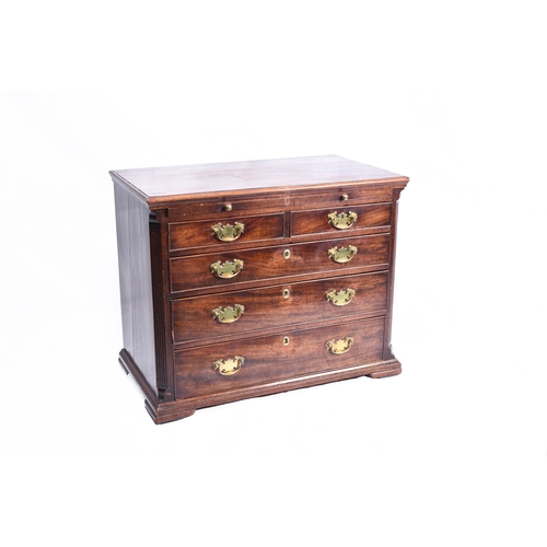 186 - A George III mahogany dressing chest the moulded top above a brushing slide and two short over three... 