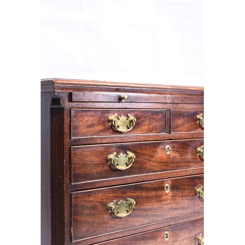 186 - A George III mahogany dressing chest the moulded top above a brushing slide and two short over three... 