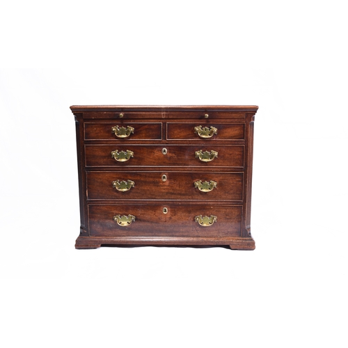 186 - A George III mahogany dressing chest the moulded top above a brushing slide and two short over three... 