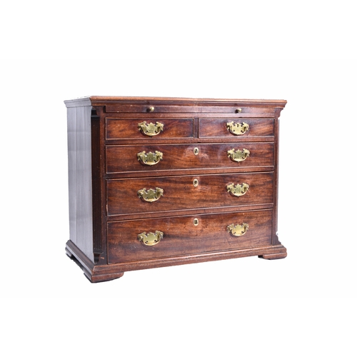 186 - A George III mahogany dressing chest the moulded top above a brushing slide and two short over three... 