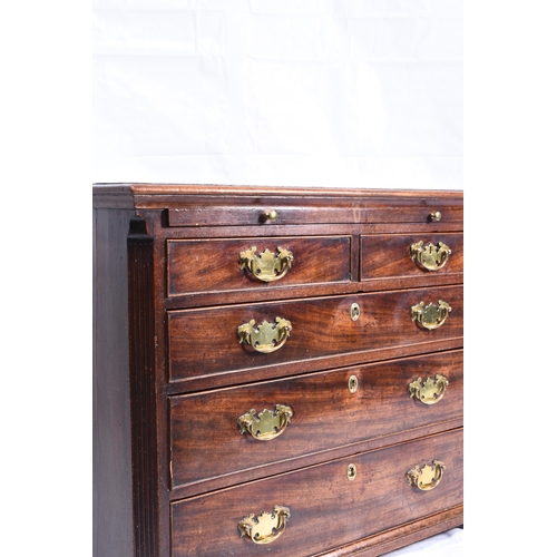 186 - A George III mahogany dressing chest the moulded top above a brushing slide and two short over three... 