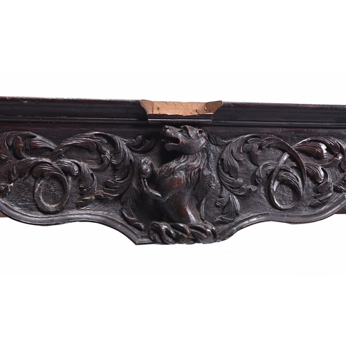 206 - A Renaissance Revival carved oak table base, 19th century The shaped frieze with central lion cresti... 