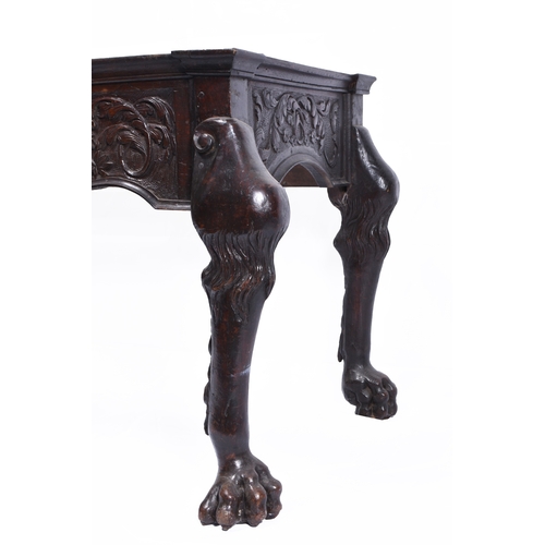 206 - A Renaissance Revival carved oak table base, 19th century The shaped frieze with central lion cresti... 