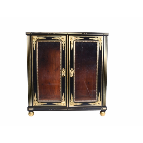 213 - A Louis XVI style ebonised and gilt-metal mounted pier cabinet With twin glazed doors enclosing thre... 