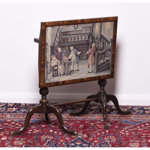 220 - A carved mahogany occasional table with tapestry inset tilt-top Raised on twin fluted tripod support... 