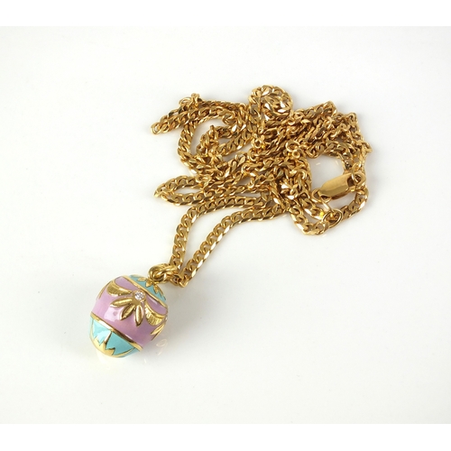 24 - A diamond and enamel egg pendant on chain, the pink and green enamelled egg set with four brilliant ... 