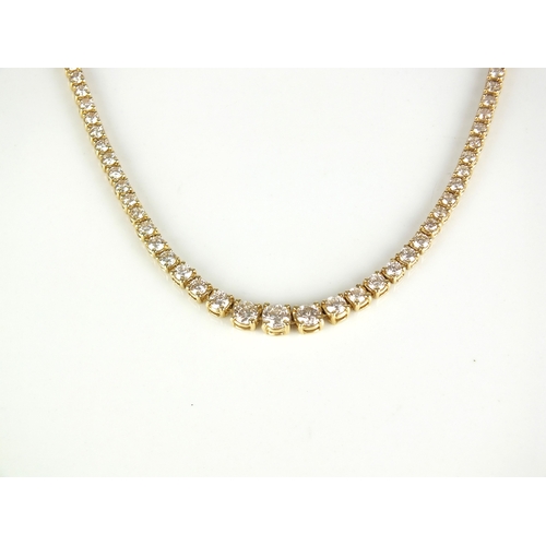 30 - A 14ct gold graduated diamond necklace, the brilliant cut diamonds claw set in yellow metal with int... 