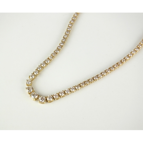 30 - A 14ct gold graduated diamond necklace, the brilliant cut diamonds claw set in yellow metal with int... 