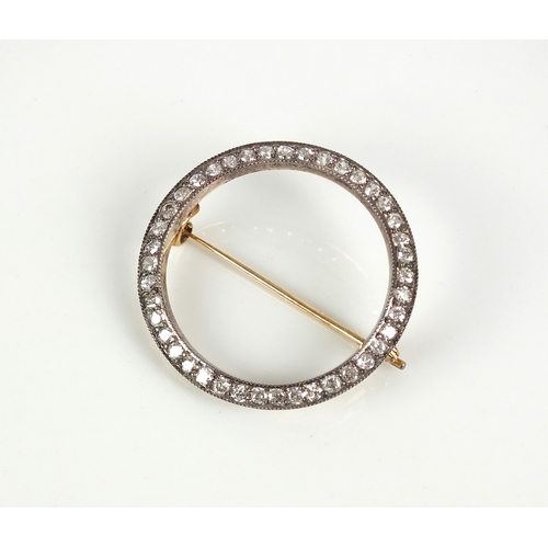 46 - An old cut diamond set circular brooch, designed as a ring of old cut diamonds claw set in white met... 