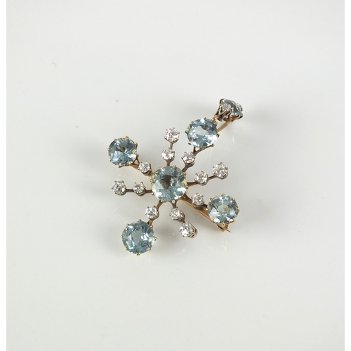 54 - An early 20th century aquamarine and diamond brooch / pendant, designed as a stylised Maltese cross ... 