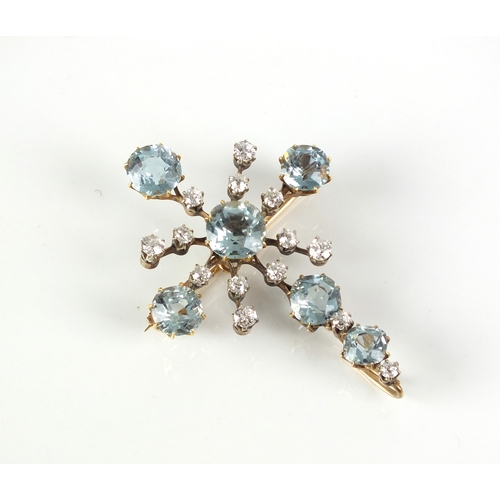 54 - An early 20th century aquamarine and diamond brooch / pendant, designed as a stylised Maltese cross ... 