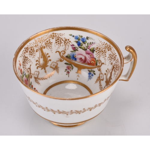 86 - A Swansea porcelain teacup and saucer, circa 1815-17, of London shape, painted with urns of colourfu... 