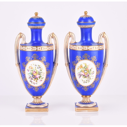 97 - A pair of Coalport porcelain vases, circa 1860, painted with oval panels of musical instruments and ... 