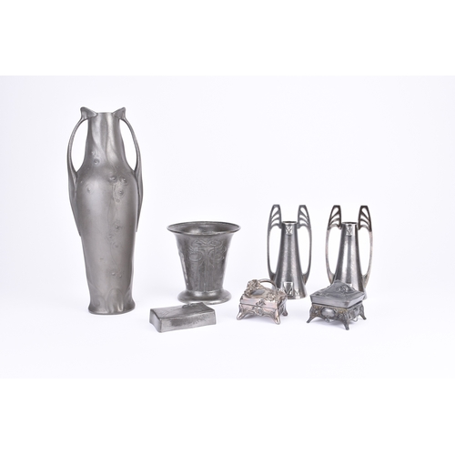 217 - An assembled group of Art Nouveau style pewter Including: A pair of WMF twin-handled vases, 15cm hig... 