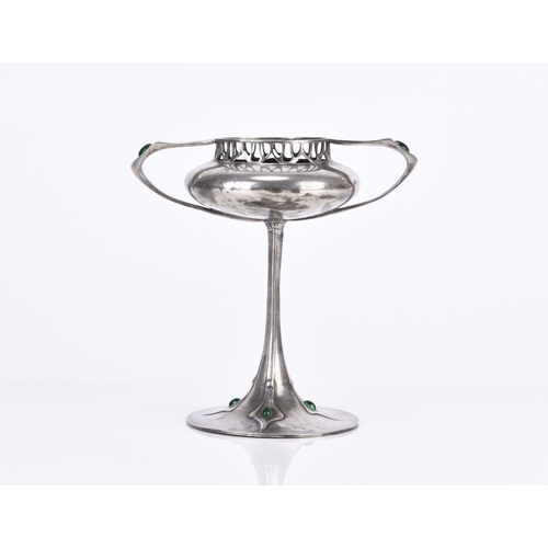 228 - An Imperial Zinn B&G inlaid pewter tazza The bowl of compressed onion form with twin angular handles... 