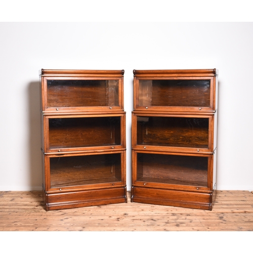 229 - A pair of mahogany Globe Wernicke style bookcases Each having three sections, the top being recessed... 