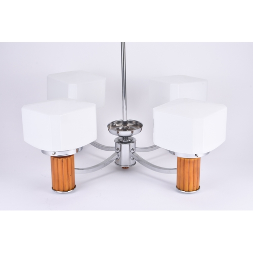 231 - An Art Deco style four-branch ceiling light The lamp heads on reeded 'amber' cylinders and with cubo... 