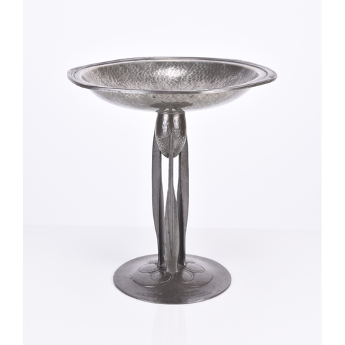 234 - Archibald Knox, a Tudric Liberty pewter tazza Model 01161, the shaped hammered bowl with 'honesty' b... 