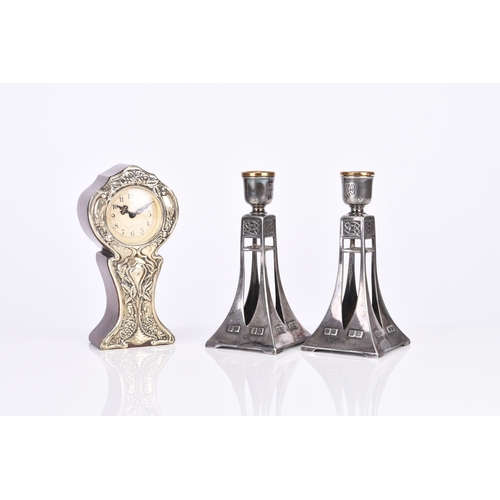 237 - A pair of WMF style candle holders Electroplated pewter, of tapering form with stylised motifs, 15cm... 