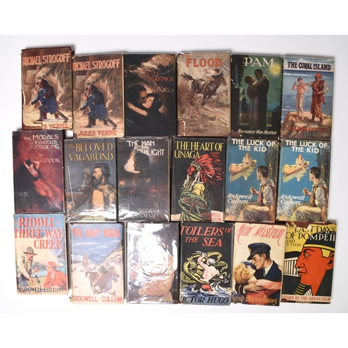 10 - READERS LIBRARY. 41 titles circa 1930s, all in dust wrappers. Including titles by Jules Verne (2), H... 