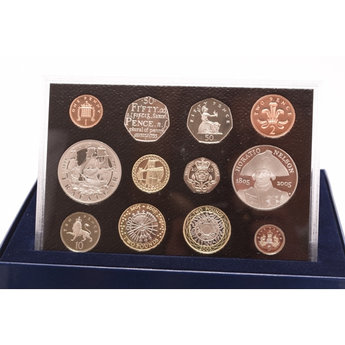 138 - Mahogany box Elizabeth II 17 silver proof coins Together with twenty five UK proof coin collections ... 