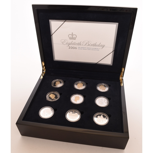 138 - Mahogany box Elizabeth II 17 silver proof coins Together with twenty five UK proof coin collections ... 