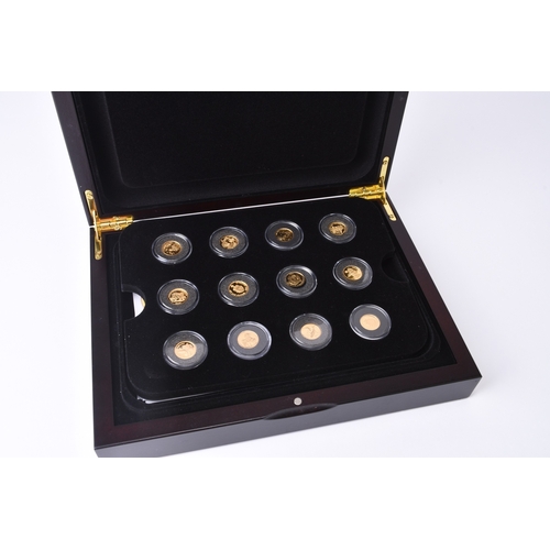 194 - UK Royal Mint. A cased set of twelve 24ct gold foreign coins within capsules and fitted wood case wi... 