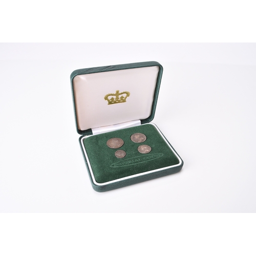 212 - Queen Anne Maundy set dated 1706, within fitted case 