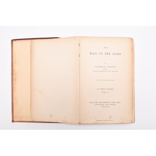 25 - ELLIOT, George, The Mill on the Floss. 3 vols, 1st edition 1860. Original cloth. Cloth damp marked o... 