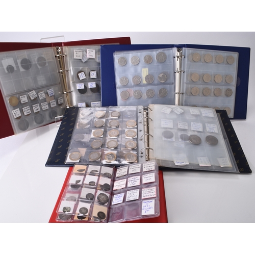 303 - Four albums of UK and foreign silver, cupro-nickel, copper and bronze coinage (Approximately 300 coi... 