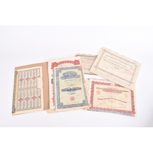 361 - Stamps, share certificates and bank notes; an accumulation of stamps on and off paper in packets plu... 