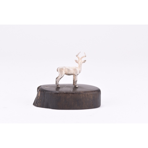 109 - A Patrick Mavros silver model of an impala, presented upon wood base, 4.5cm high