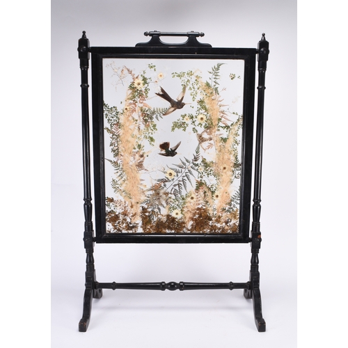 55 - Taxidermy: A late Victorian ornithological fire screen The ebonised wood frame with turned uprights,... 