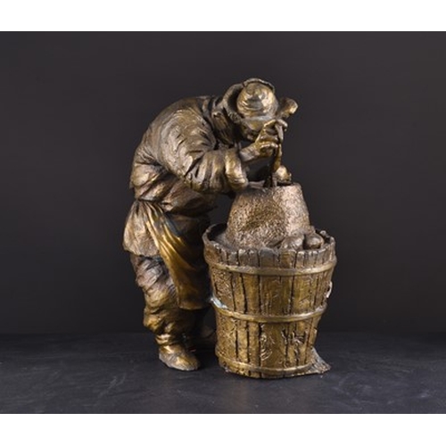 102 - A Chinese bronze alloy figure of a potato vendor, contemporary The aged figure in winter garb at wor... 