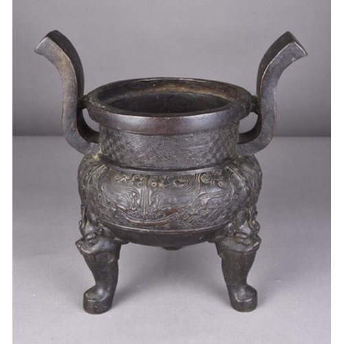 107 - A Chinese bronze censer, possibly Ming Dynasty Thickly cast with a pair of curving strap handles ris... 