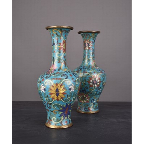 112 - A pair of Chinese cloisonne vases, Qing Dynasty Early 19th century, of bottle form and worked with a... 