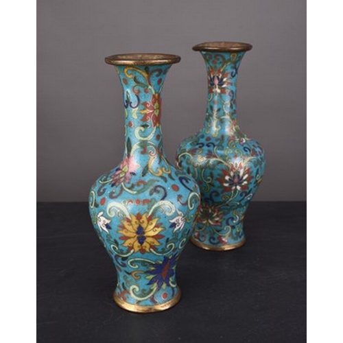 112 - A pair of Chinese cloisonne vases, Qing Dynasty Early 19th century, of bottle form and worked with a... 