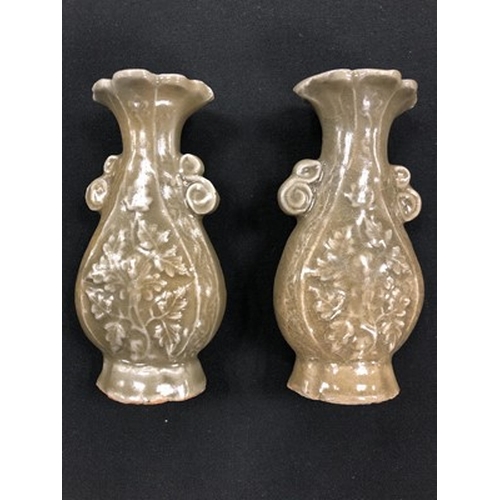 12 - A pair of Longquan celadon vases, Yuan Dynasty Of ovoid 'Hu' form with twin scroll handles and lobed... 