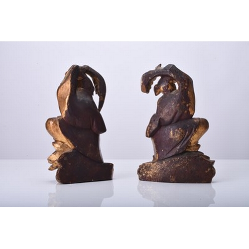 131 - A pair of Chinese gilt wood figures of the twins Hehe Erxian Qing Dynasty, modelled standing on clou... 