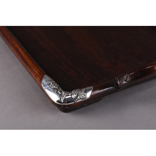 133 - A Chinese silver-mounted rosewood tray, circa 1900 Of rectangular outline with twin yoke handles, th... 