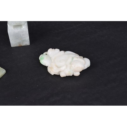 159 - Three Chinese jadeite carvings, Qing Dynasty Including: A miniature seal carved with a guardian lion... 