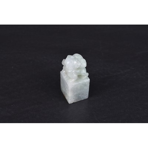 159 - Three Chinese jadeite carvings, Qing Dynasty Including: A miniature seal carved with a guardian lion... 