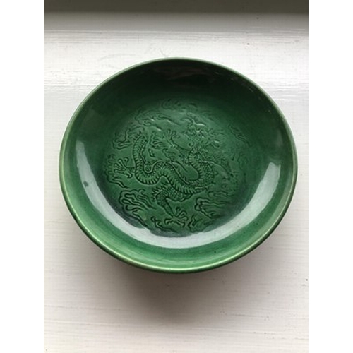 16 - A Chinese Langyao type green glazed dragon dish, probably Kangxi Of plain circular form, the inside ... 