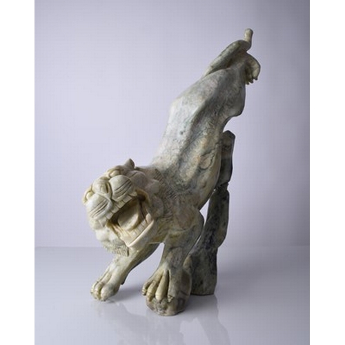 160 - A Chinese carved quartzite figure of a stalking tiger, 20th century Of mottled green hue, stylistica... 