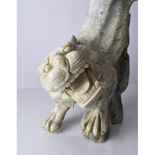 160 - A Chinese carved quartzite figure of a stalking tiger, 20th century Of mottled green hue, stylistica... 