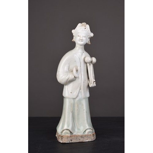 17 - Three Chinese glazed figures, Qing Dynnasty Including: A celadon figure of a standing maiden, 19cm h... 