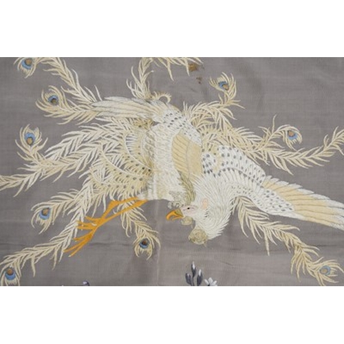 184 - A Chinese embroidered silk bedspread, 20th century Finely woven in coloured threads with a peacock a... 