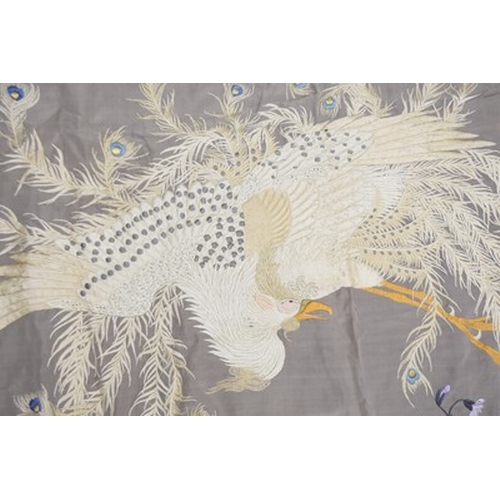 184 - A Chinese embroidered silk bedspread, 20th century Finely woven in coloured threads with a peacock a... 