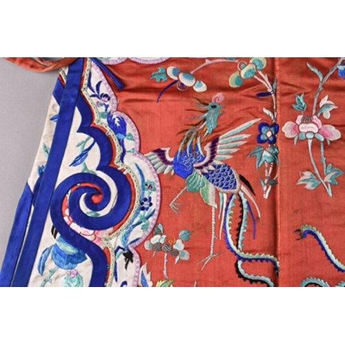 187 - A Chinese silk embroidered child's robe, Qing Dynasty Worked in coloured threads with phoenix birds,... 